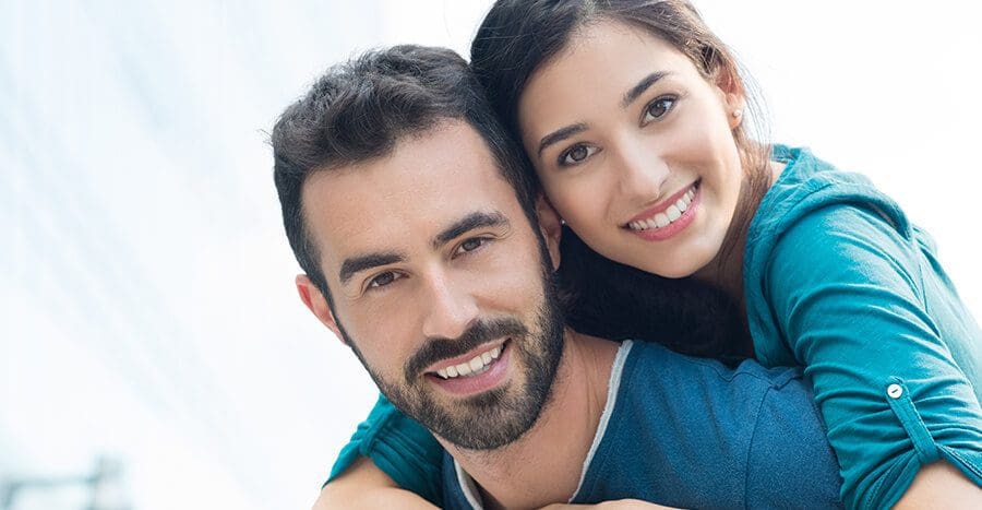 brunette couple smiling